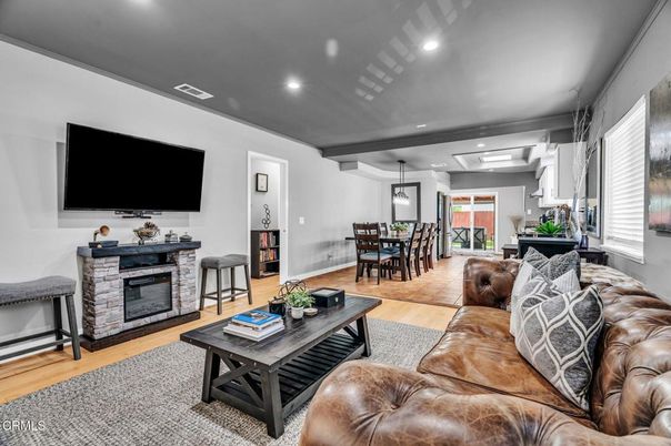 Dining room, Fireplace, Interior, Living room, Pendant Lights, Recessed Lighting, Wood Texture Flooring