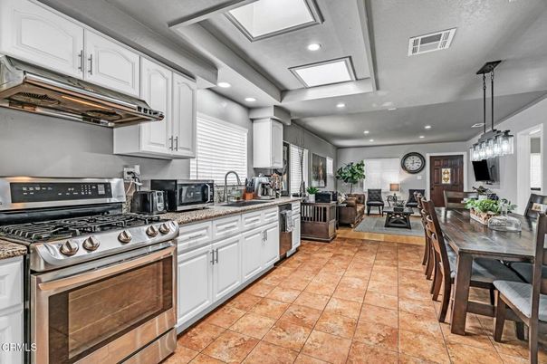 Dining room, Fireplace, Interior, Kitchen, Living room, Pendant Lights, Recessed Lighting, Stainless Steel Appliances