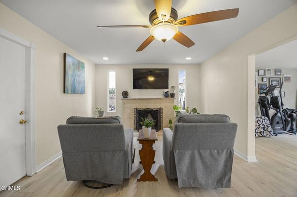 Fireplace, Fitness Equipment, Interior, Living room, Recessed Lighting, Wood Texture Flooring