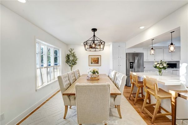 Chandelier, Dining room, Interior, Kitchen, Pendant Lights, Recessed Lighting, Stainless Steel Appliances, Wood Texture Flooring