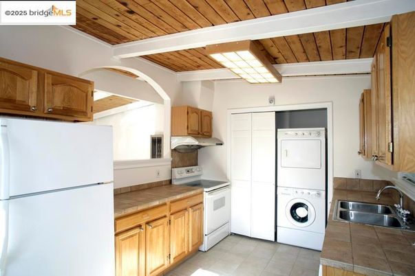 Interior, Kitchen, Tile Countertops, Washer, Wooden Ceilings