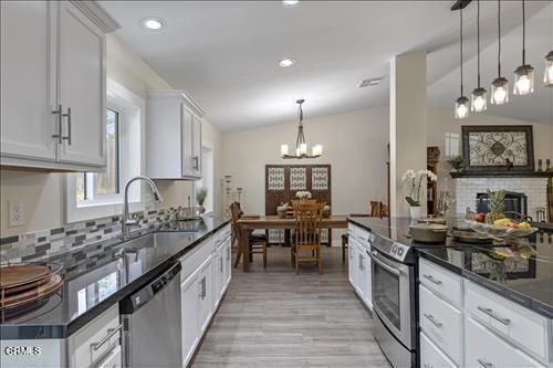 Chandelier, Dining room, Fireplace, Interior, Kitchen, Pendant Lights, Recessed Lighting, Wood Texture Flooring