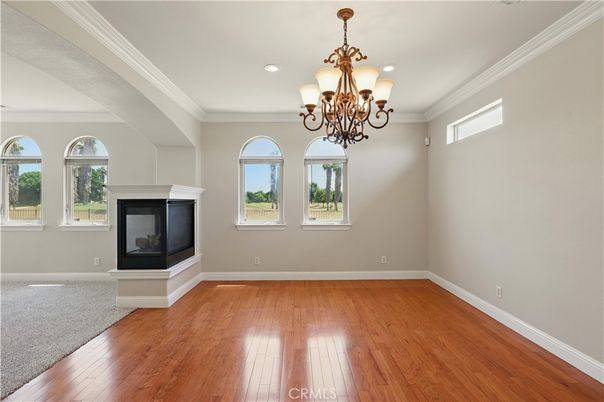 Chandelier, Empty room, Fireplace, Interior, Recessed Lighting, Wood Texture Flooring