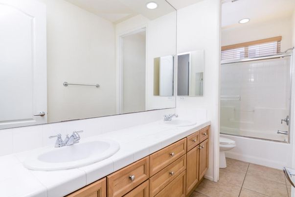 Bathroom, Dual Sink Vanities, Glass Shower, Interior, Recessed Lighting, Tile Countertops