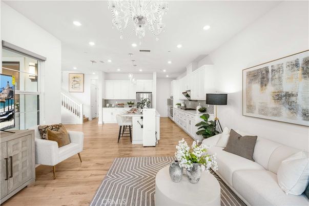 Chandelier, Dining room, Interior, Kitchen, Living room, Pendant Lights, Recessed Lighting, Stainless Steel Appliances, Wood Texture Flooring
