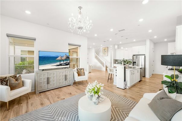 Chandelier, Dining room, Interior, Kitchen, Living room, Pendant Lights, Recessed Lighting, Stainless Steel Appliances, Water, Wood Texture Flooring