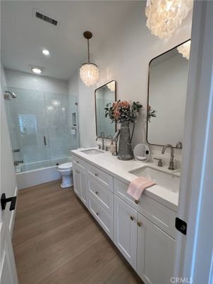 Bathroom, Chandelier, Dual Sink Vanities, Glass Shower, Interior, Recessed Lighting, Wood Texture Flooring