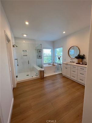 Bathroom, Free Standing Baths, Glass Shower, Interior, Recessed Lighting, Wood Texture Flooring