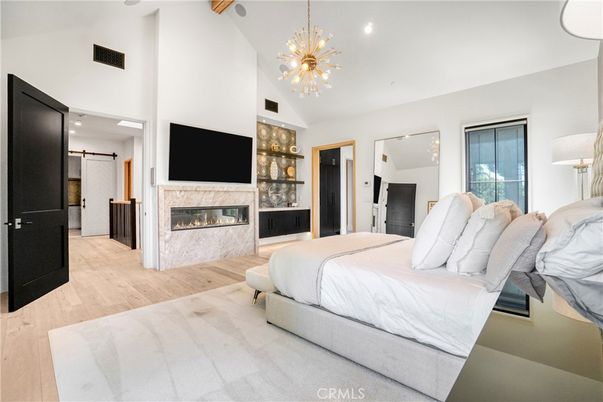 Bedroom, Fireplace, Interior, Pendant Lights, Recessed Lighting, Wood Texture Flooring