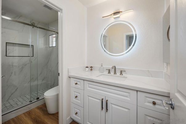 Bathroom, Glass Shower, Interior, Marble Walls, Wood Texture Flooring
