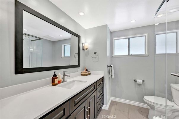 Bathroom, Dual Sink Vanities, Interior, Recessed Lighting, Wood Texture Flooring