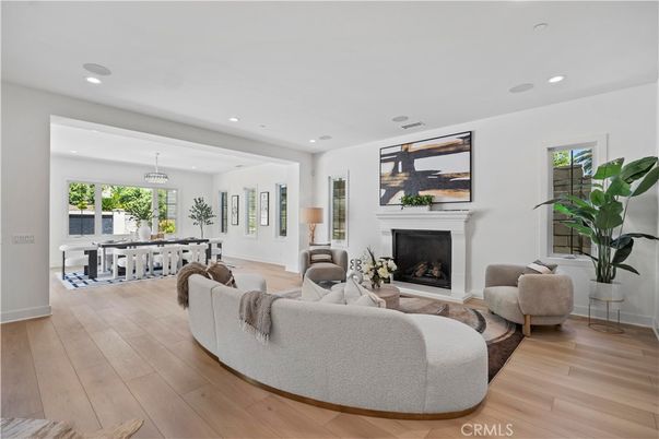 Fireplace, Game Room, Interior, Living room, Pendant Lights, Recessed Lighting, Wood Texture Flooring