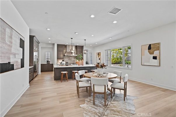 Dining room, Interior, Kitchen, Pendant Lights, Recessed Lighting, Stainless Steel Appliances, Wood Texture Flooring