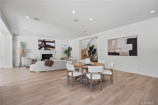 Dining room, Fireplace, Interior, Living room, Recessed Lighting, Wood Texture Flooring