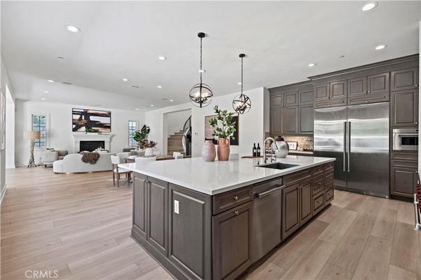Dining room, Fireplace, Interior, Kitchen, Living room, Pendant Lights, Recessed Lighting, Stainless Steel Appliances, Wood Texture Flooring