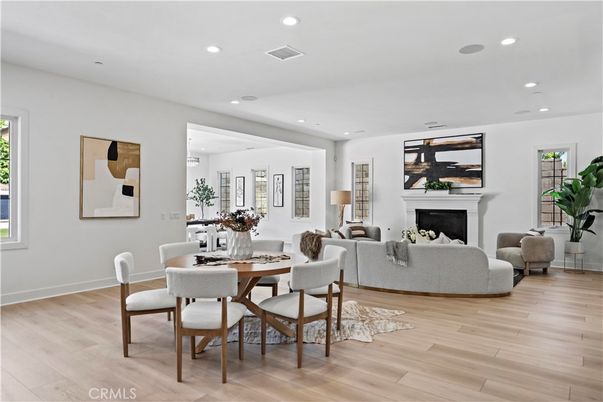 Dining room, Fireplace, Interior, Living room, Recessed Lighting, Wood Texture Flooring