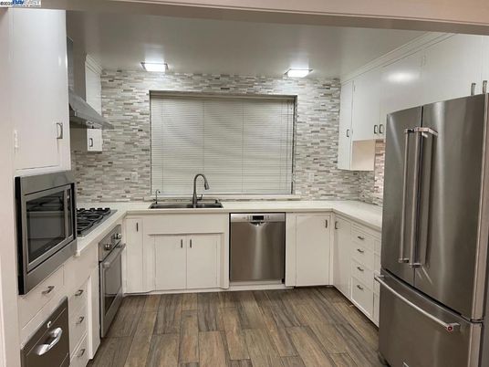 Interior, Kitchen, Stainless Steel Appliances, Stone Walls, Wood Texture Flooring