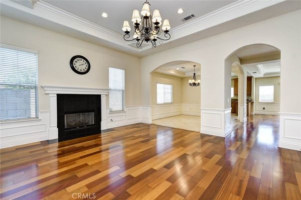 Chandelier, Empty room, Fireplace, Interior, Recessed Lighting, Wood Texture Flooring