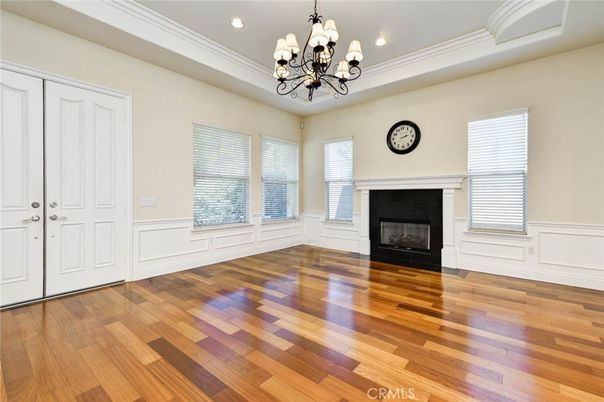 Chandelier, Empty room, Fireplace, Interior, Recessed Lighting, Wood Texture Flooring