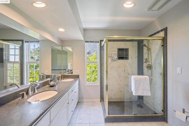 Bathroom, Dual Sink Vanities, Glass Shower, Interior, Marble, Marble Walls, Recessed Lighting