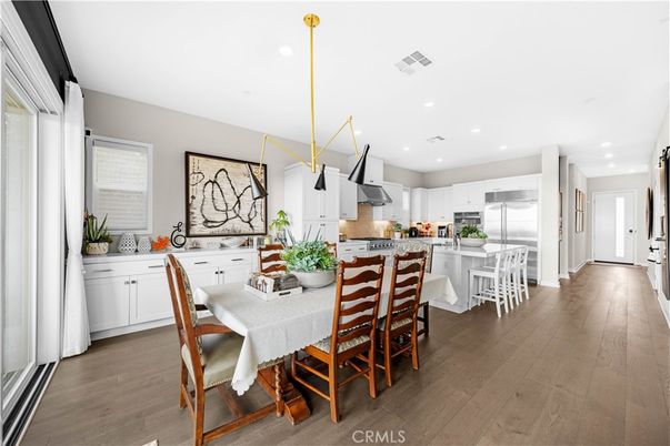 Dining room, Interior, Kitchen, Pendant Lights, Recessed Lighting, Stainless Steel Appliances, Wood Texture Flooring