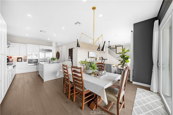 Dining room, Interior, Kitchen, Pendant Lights, Recessed Lighting, Stainless Steel Appliances, Wood Texture Flooring