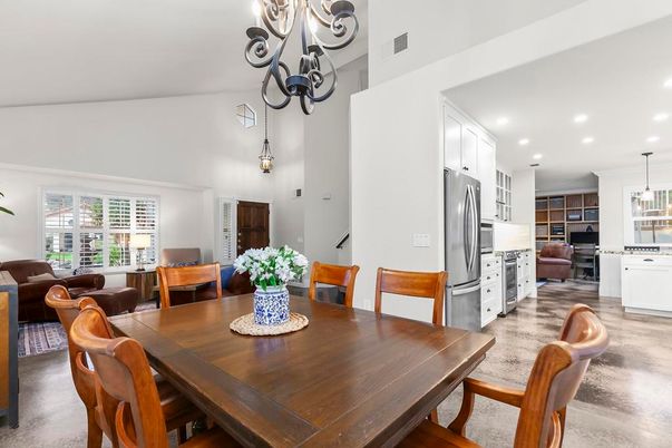 Chandelier, Dining room, Interior, Kitchen, Living room, Pendant Lights, Recessed Lighting, Stainless Steel Appliances, Wood Texture Flooring