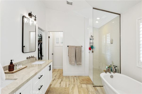Bathroom, Dual Sink Vanities, Glass Shower, Interior, Recessed Lighting, Wood Texture Flooring