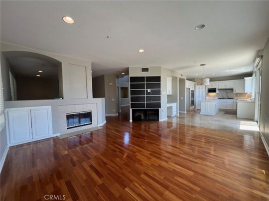 Empty room, Fireplace, Interior, Kitchen, Pendant Lights, Recessed Lighting, Wood Texture Flooring
