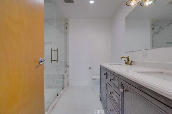 Bathroom, Dual Sink Vanities, Glass Shower, Interior, Marble Walls, Recessed Lighting