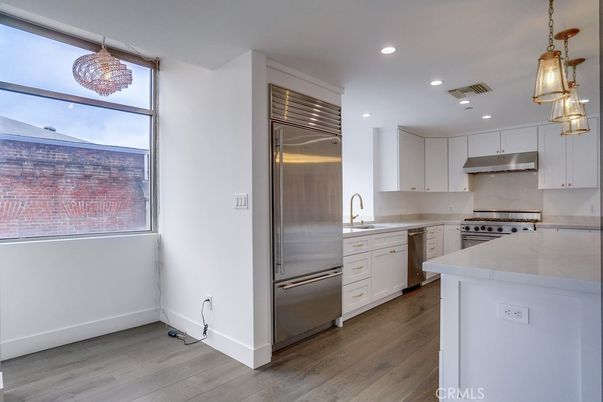 Chandelier, Interior, Kitchen, Pendant Lights, Recessed Lighting, Stainless Steel Appliances, Wood Texture Flooring