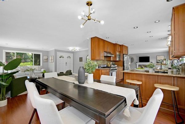 Dining room, Interior, Kitchen, Pendant Lights, Recessed Lighting, Stainless Steel Appliances, Wood Texture Flooring