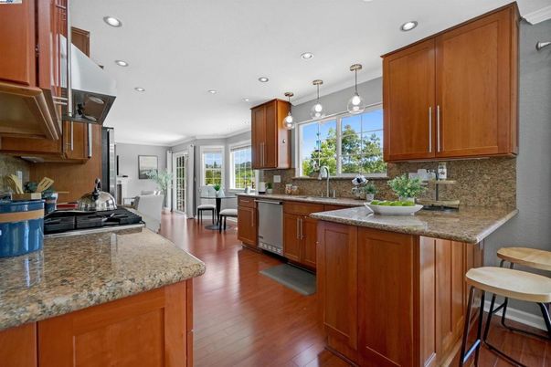 Dining room, Interior, Kitchen, Pendant Lights, Recessed Lighting, Stainless Steel Appliances, Wood Texture Flooring