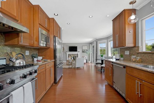 Dining room, Fireplace, Interior, Kitchen, Living room, Pendant Lights, Recessed Lighting, Stainless Steel Appliances, Wood Texture Flooring