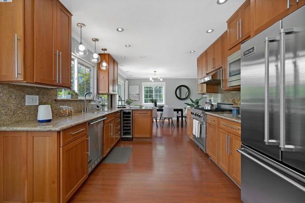 Dining room, Interior, Kitchen, Pendant Lights, Recessed Lighting, Stainless Steel Appliances, Wood Texture Flooring