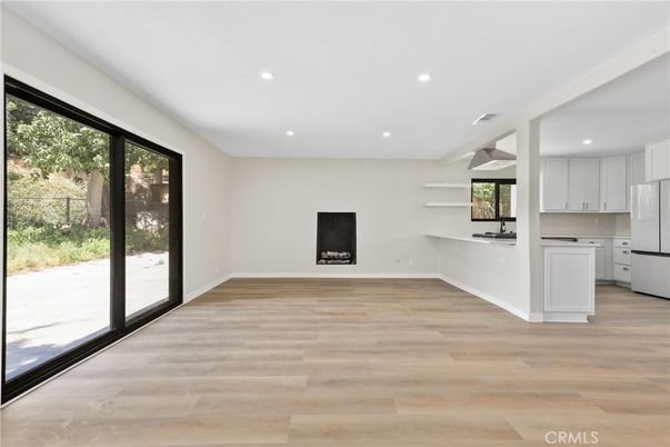 Empty room, Fireplace, Interior, Kitchen, Recessed Lighting, Wood Texture Flooring