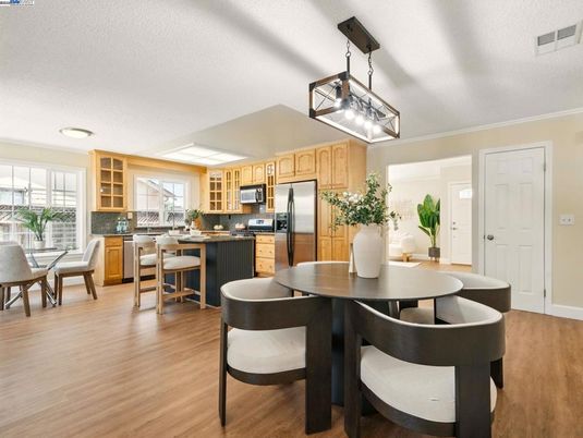 Dining room, Interior, Kitchen, Pendant Lights, Recessed Lighting, Stainless Steel Appliances, Wood Texture Flooring