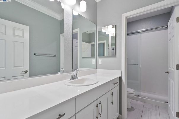 Bathroom, Dual Sink Vanities, Glass Shower, Interior, Wood Texture Flooring