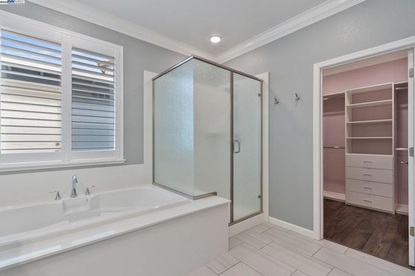 Bathroom, Glass Shower, Interior, Recessed Lighting, Walk-in Closets, Wood Texture Flooring