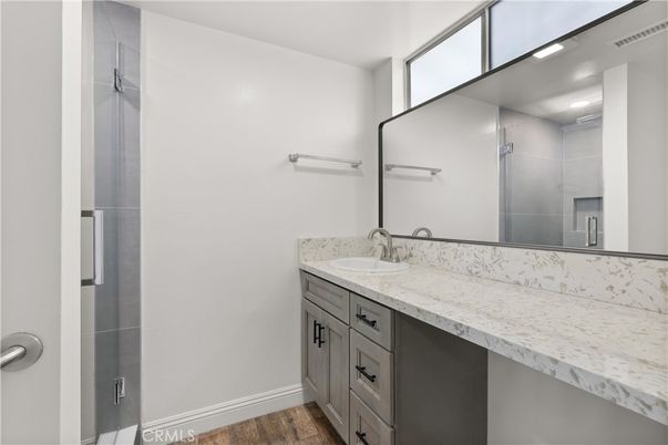 Bathroom, Dual Sink Vanities, Interior, Recessed Lighting, Wood Texture Flooring