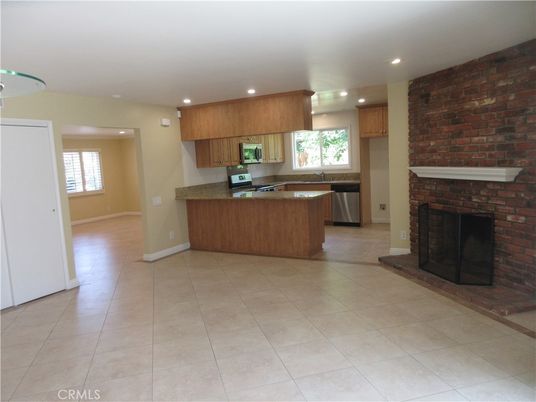 Fireplace, Interior, Kitchen, Recessed Lighting, Stainless Steel Appliances, Stone Walls