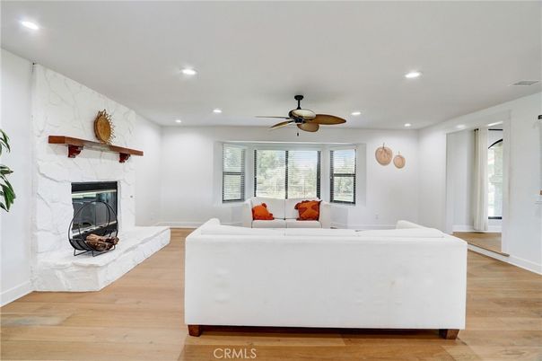 Fireplace, Interior, Living room, Marble Walls, Recessed Lighting, Wood Texture Flooring