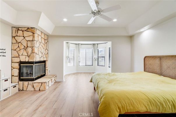 Bedroom, Fireplace, Interior, Recessed Lighting, Stone Walls, Wood Texture Flooring