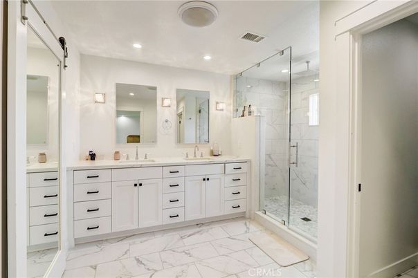 Bathroom, Dual Sink Vanities, Glass Shower, Interior, Marble, Marble Walls, Recessed Lighting