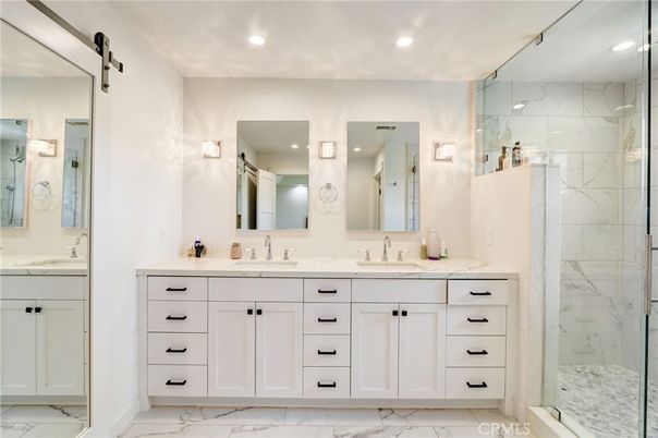 Bathroom, Dual Sink Vanities, Glass Shower, Interior, Marble, Marble Walls, Recessed Lighting