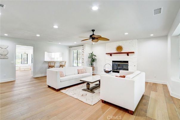 Fireplace, Interior, Living room, Marble Walls, Recessed Lighting, Wood Texture Flooring
