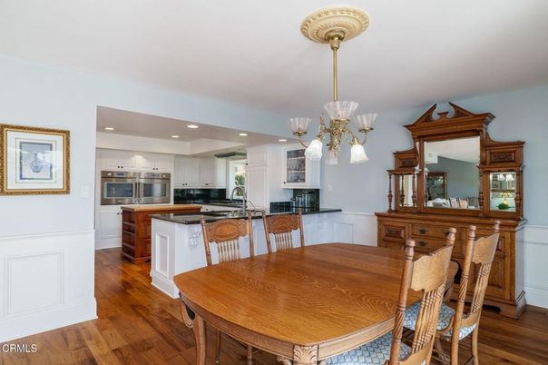 Chandelier, Dining room, Interior, Kitchen, Recessed Lighting, Stainless Steel Appliances, Wood Texture Flooring