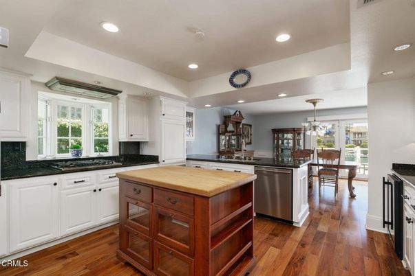 Chandelier, Dining room, Interior, Kitchen, Recessed Lighting, Stainless Steel Appliances, Wood Texture Flooring