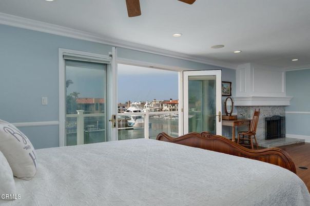 Bedroom, Fireplace, Interior, Recessed Lighting, Water, Wood Texture Flooring