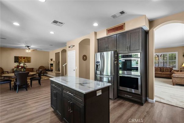 Dining room, Interior, Kitchen, Living room, Recessed Lighting, Stainless Steel Appliances, Wood Texture Flooring